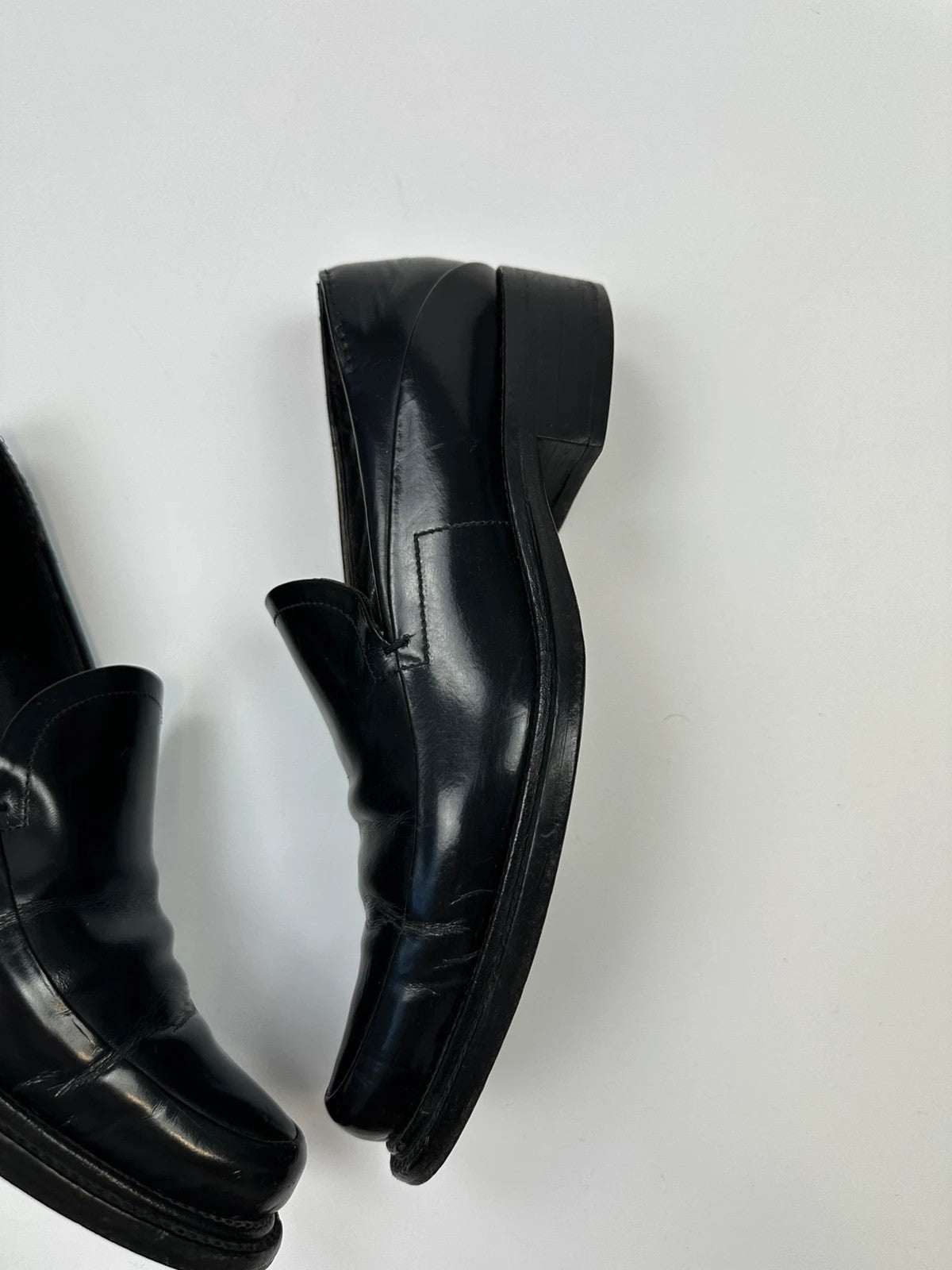 Prada black patent leather loafers with pointy toe and vintage 90's design.