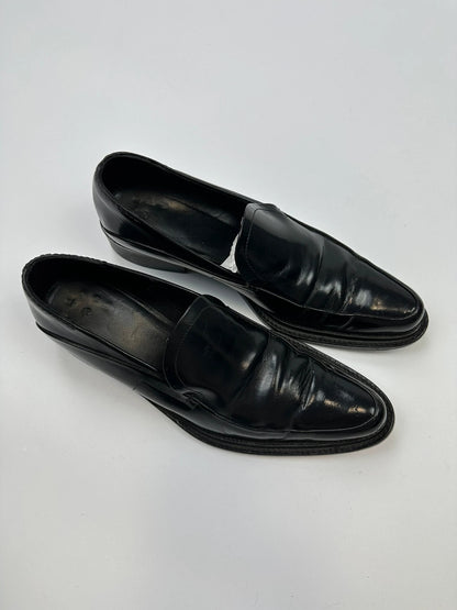Prada black patent leather loafers with pointy toe and vintage 90's design.