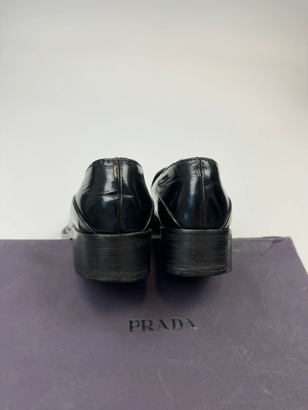 Prada black patent leather loafers with pointy toe and vintage 90's design.
