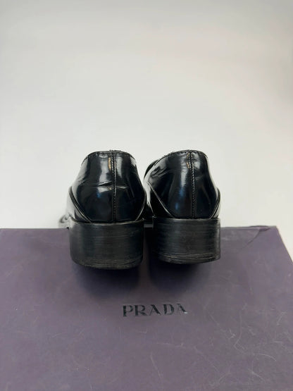 Prada black patent leather loafers with pointy toe and vintage 90's design.