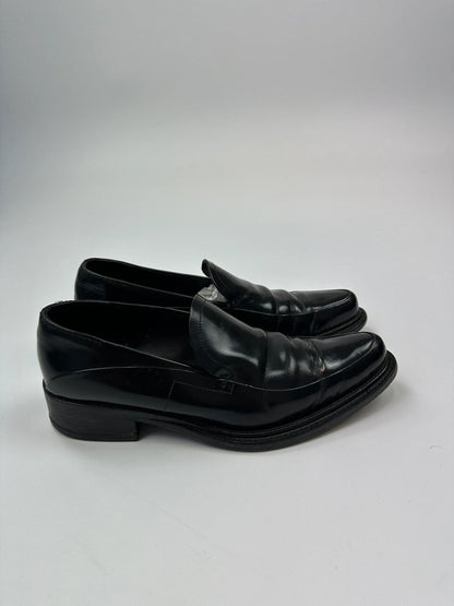 Prada black patent leather loafers with pointy toe and vintage 90's design.