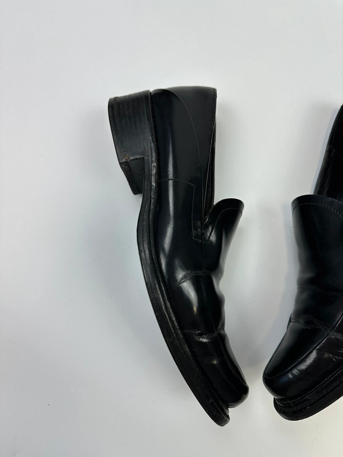 Prada black patent leather loafers with pointy toe and vintage 90's design.
