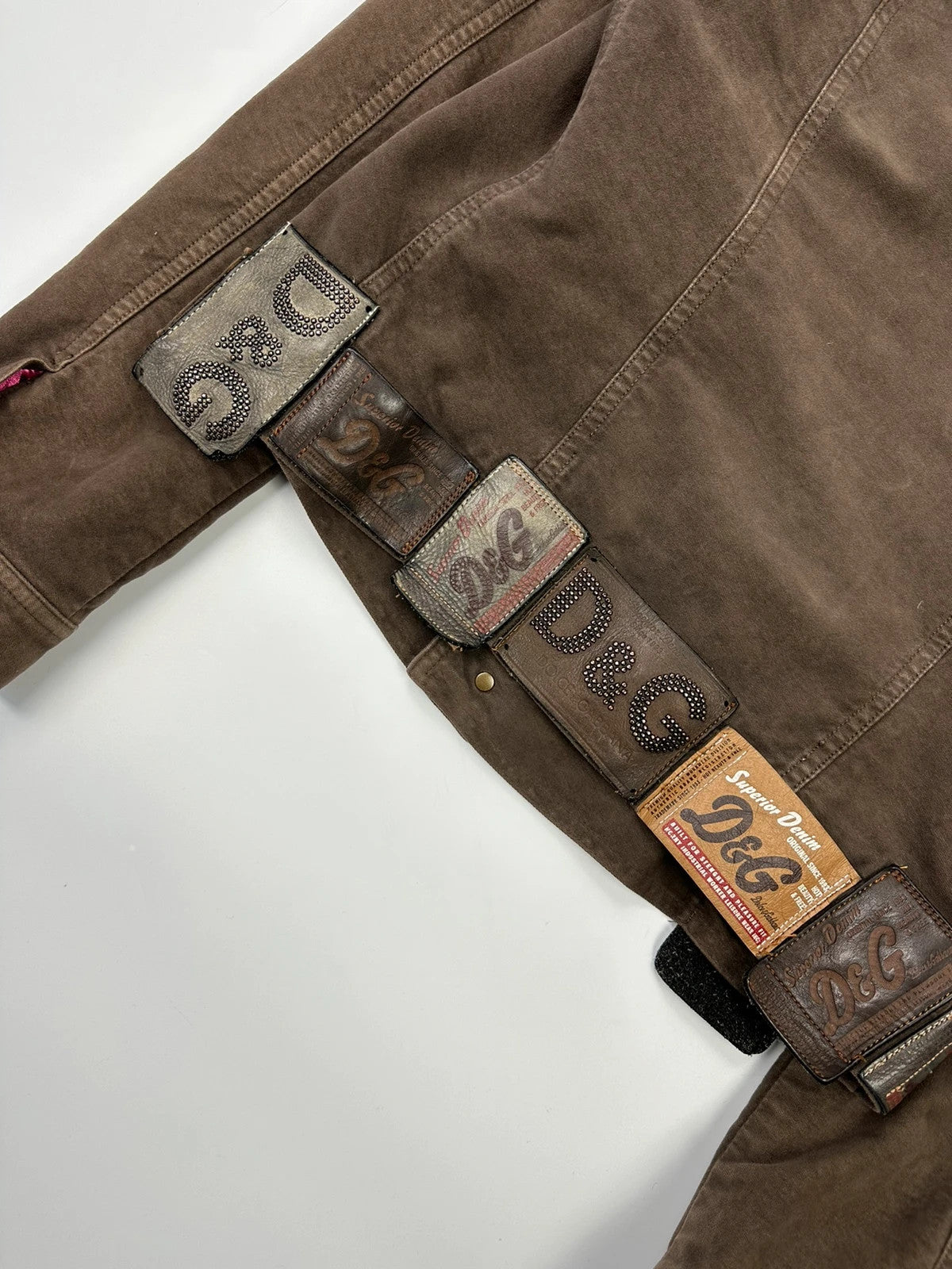 Dolce & Gabbana brown jacket with patch tags and vintage 2003 runway details.