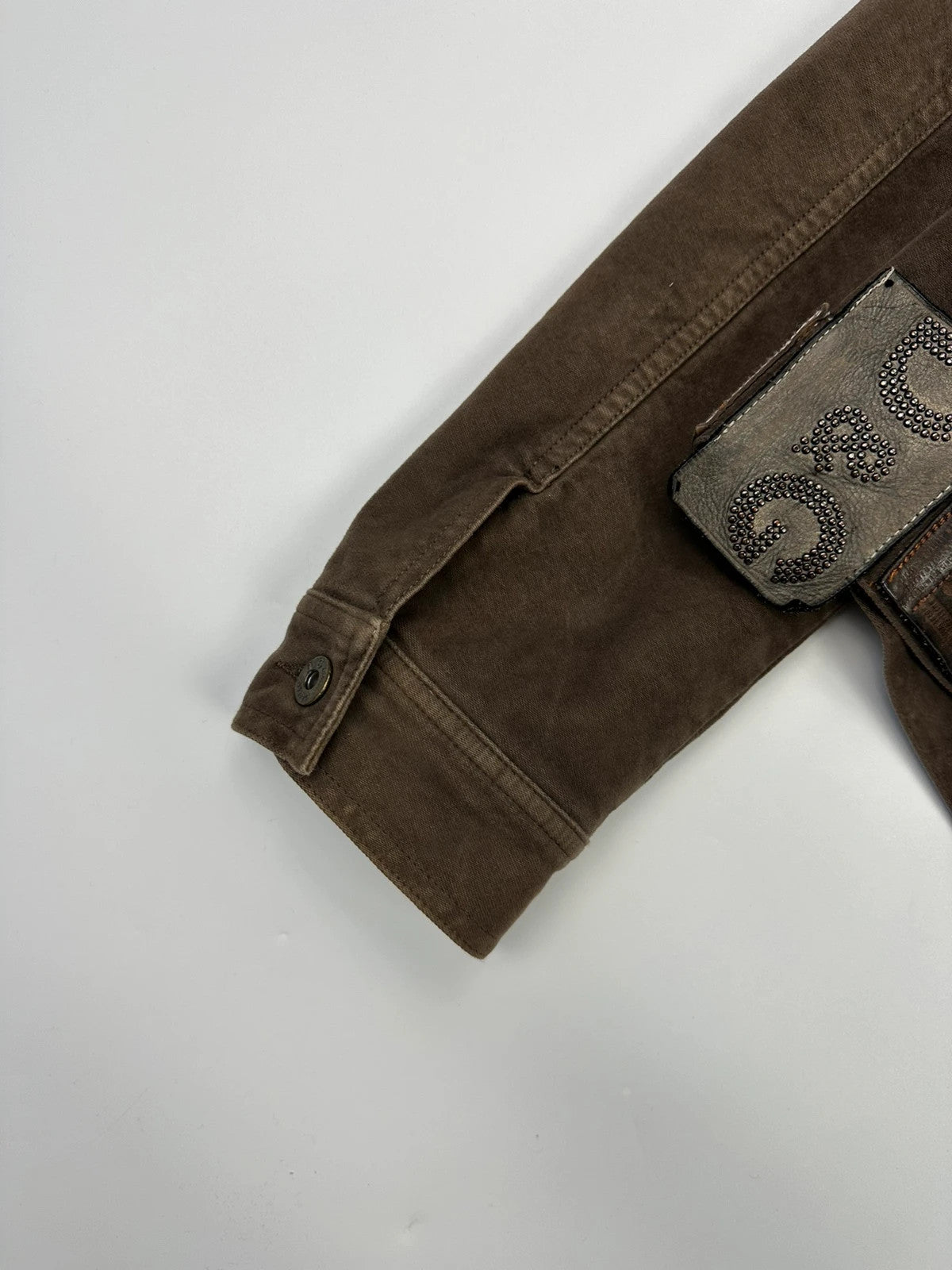 Dolce & Gabbana brown jacket with patch tags and vintage 2003 runway details.