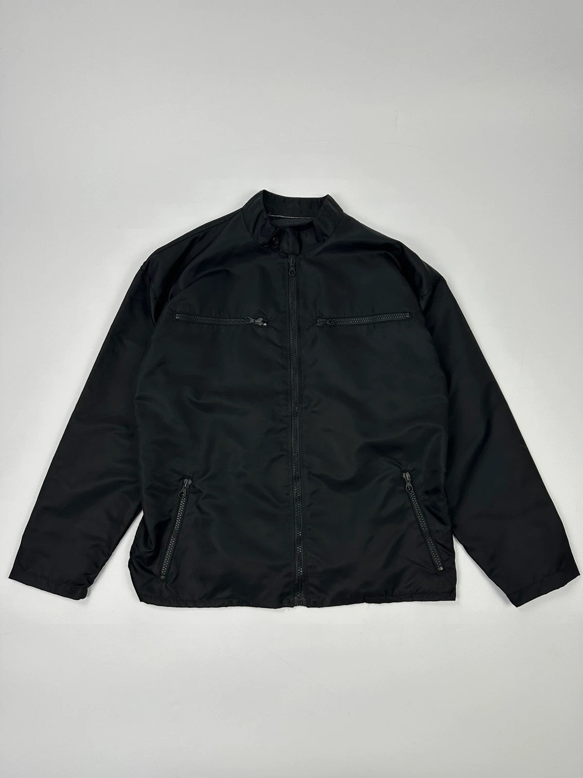 Marithé François Girbaud black nylon crop jacket with open back detail and vintage 90's style.
