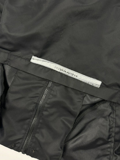 Marithé François Girbaud black nylon crop jacket with open back detail and vintage 90's style.