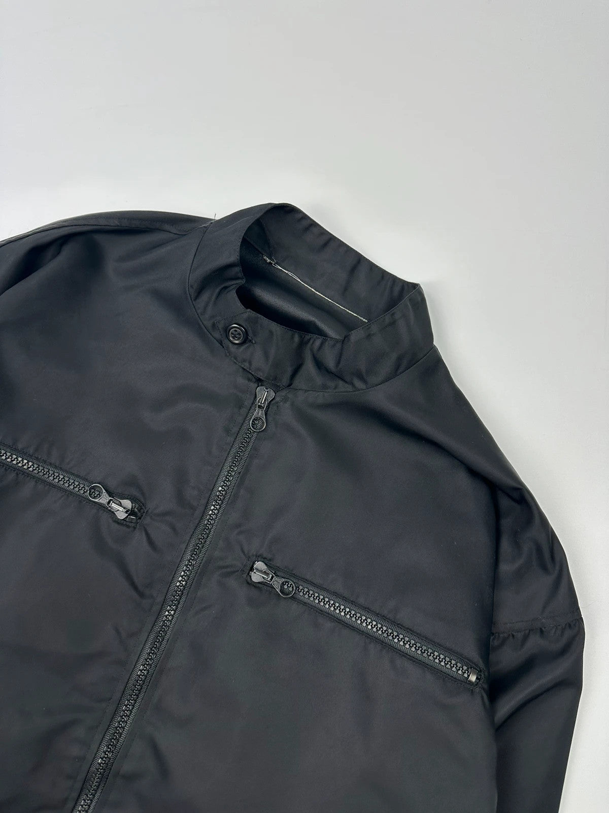 Marithé François Girbaud black nylon crop jacket with open back detail and vintage 90's style.
