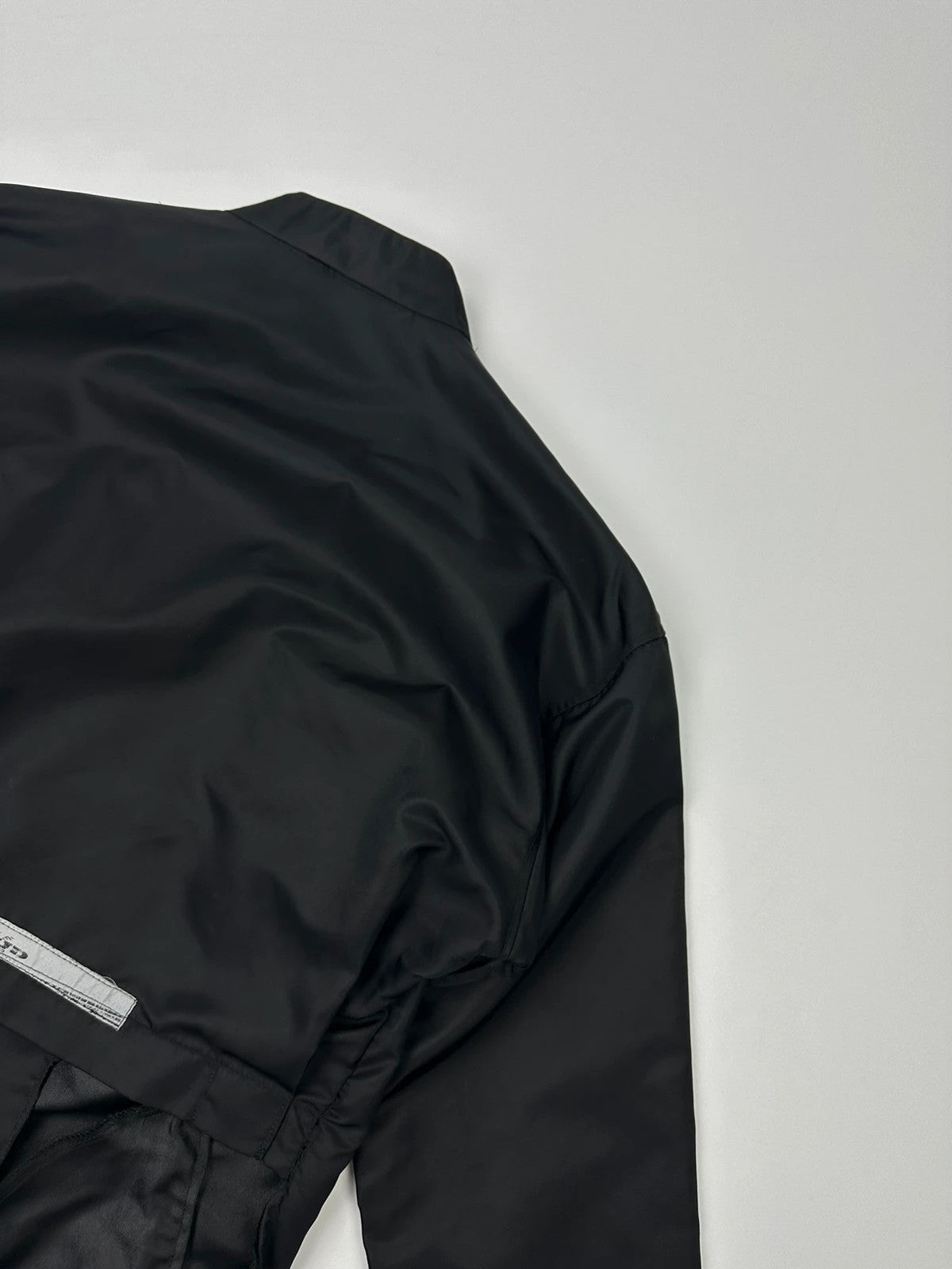 Marithé François Girbaud black nylon crop jacket with open back detail and vintage 90's style.