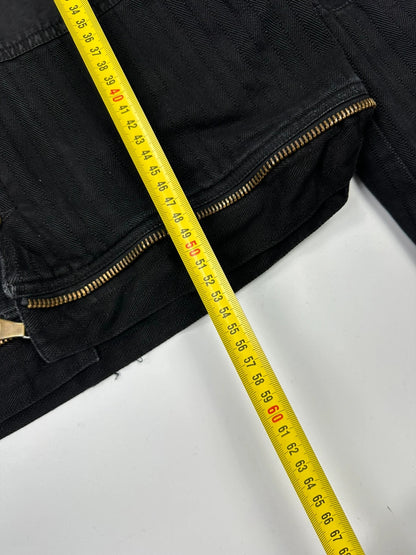 Dolce & Gabbana black denim jacket with detachable features and logo detailing.