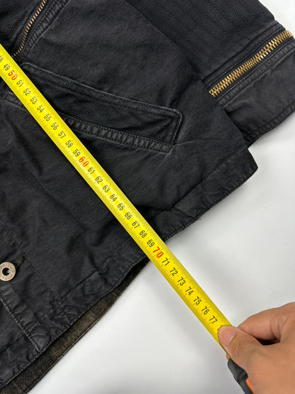 Dolce & Gabbana black denim jacket with detachable features and logo detailing.