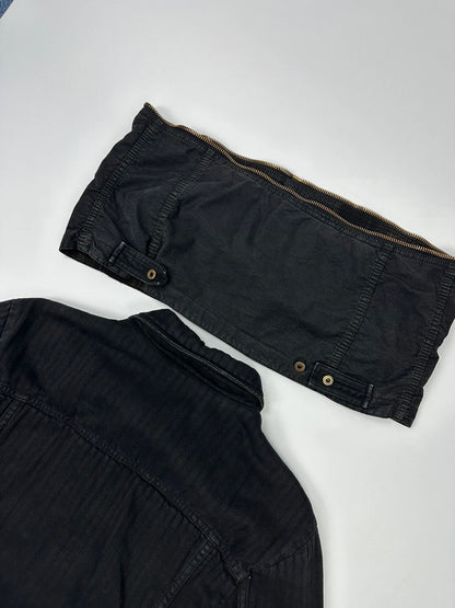 Dolce & Gabbana black denim jacket with detachable features and logo detailing.