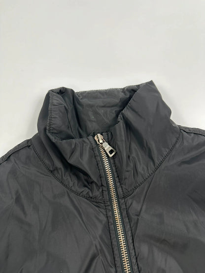 Prada black padded nylon jacket with double zip and minimalist design.