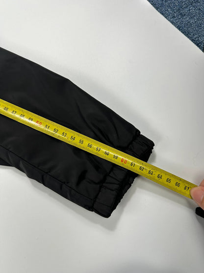Prada black padded nylon jacket with double zip and minimalist design.