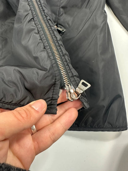 Prada black padded nylon jacket with double zip and minimalist design.