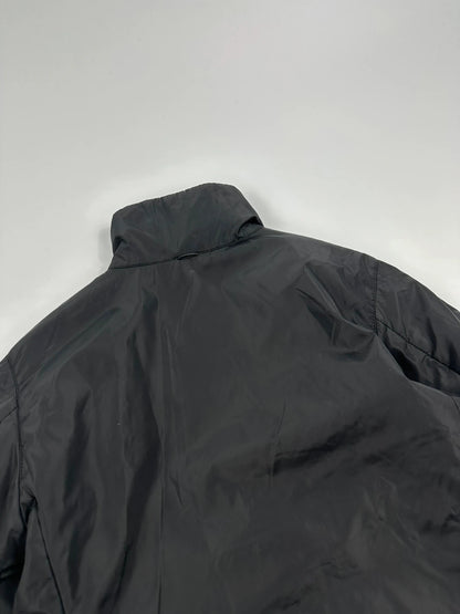 Prada black padded nylon jacket with double zip and minimalist design.