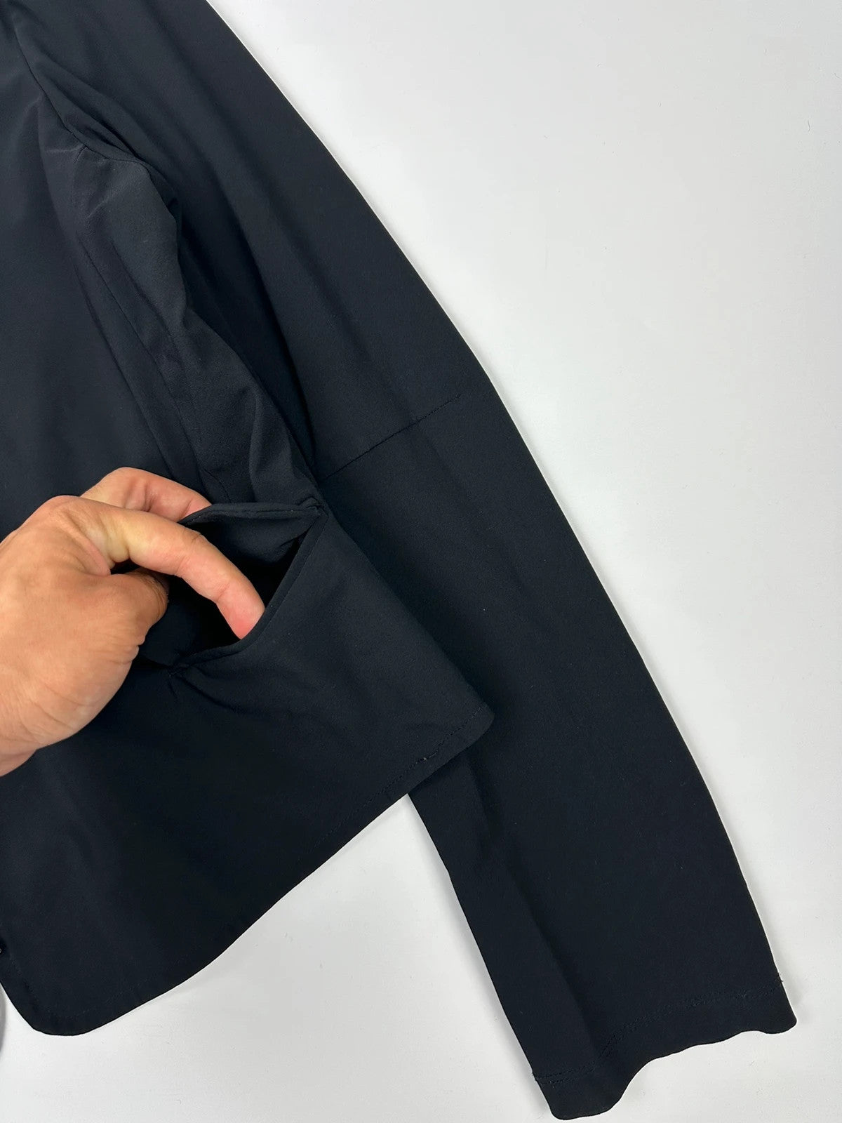 Marithé François Girbaud black fitted jacket with subtle logo detail and sleek design.