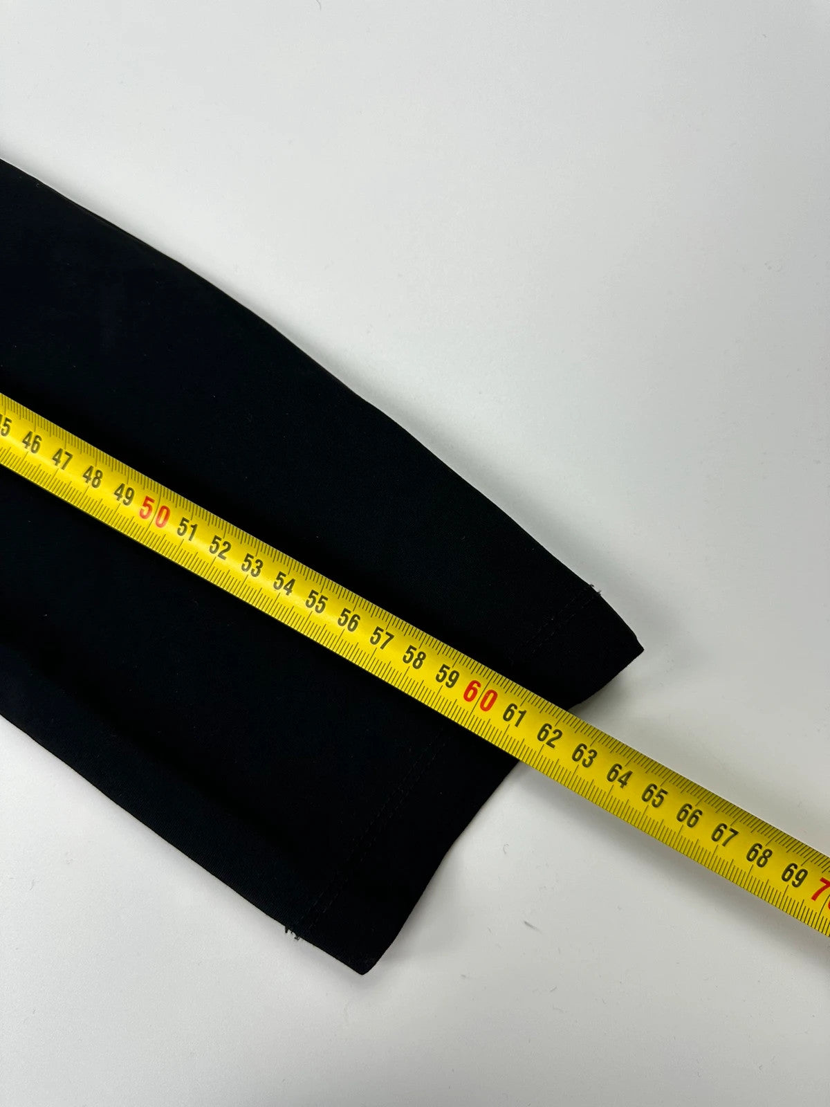 Marithé François Girbaud black fitted jacket with subtle logo detail and sleek design.