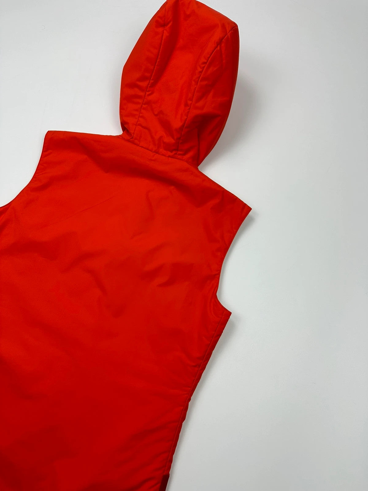 Prada orange nylon sleeveless vest jacket with logo detail from SS1999 collection.