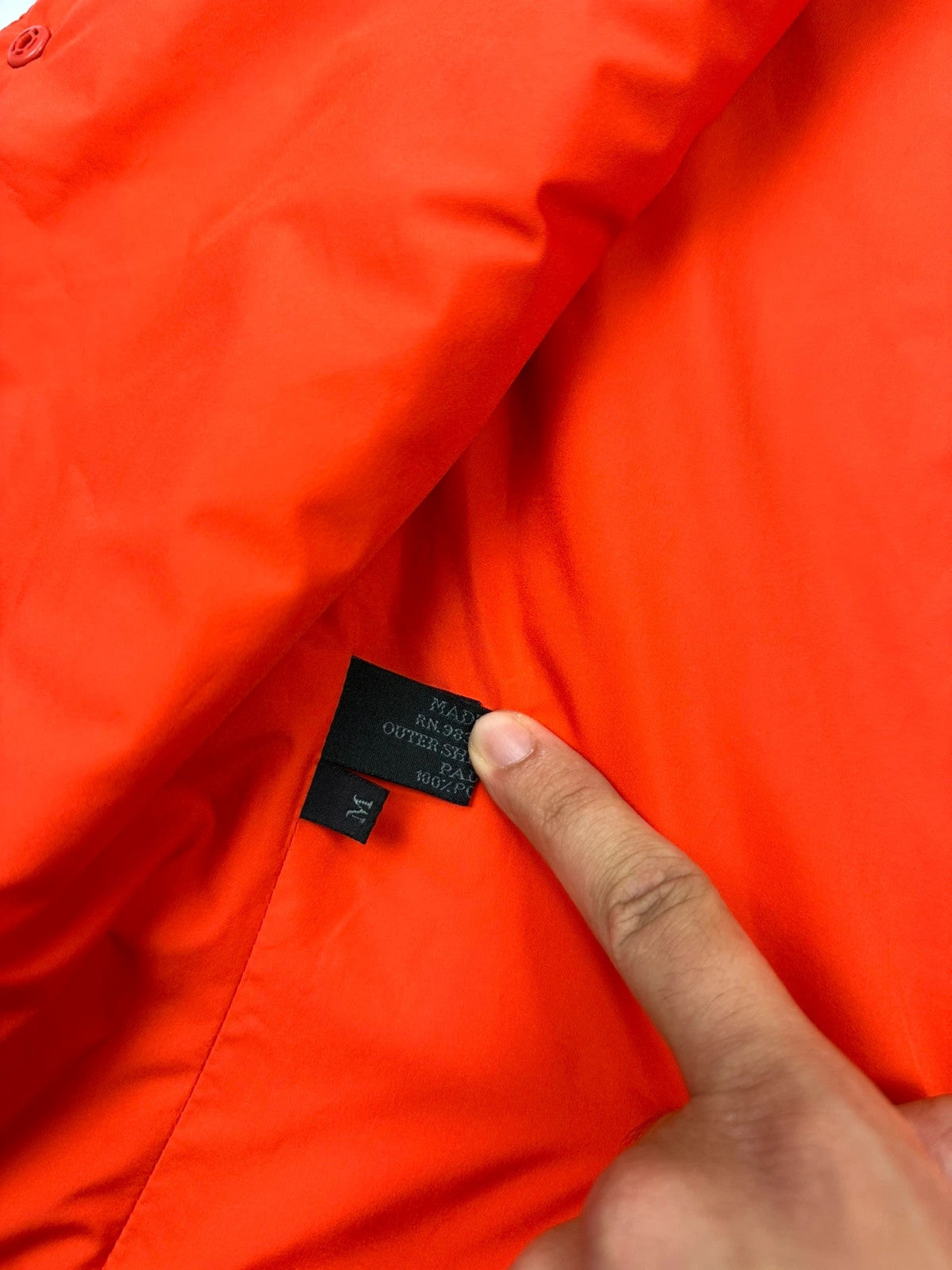 Prada orange nylon sleeveless vest jacket with logo detail from SS1999 collection.