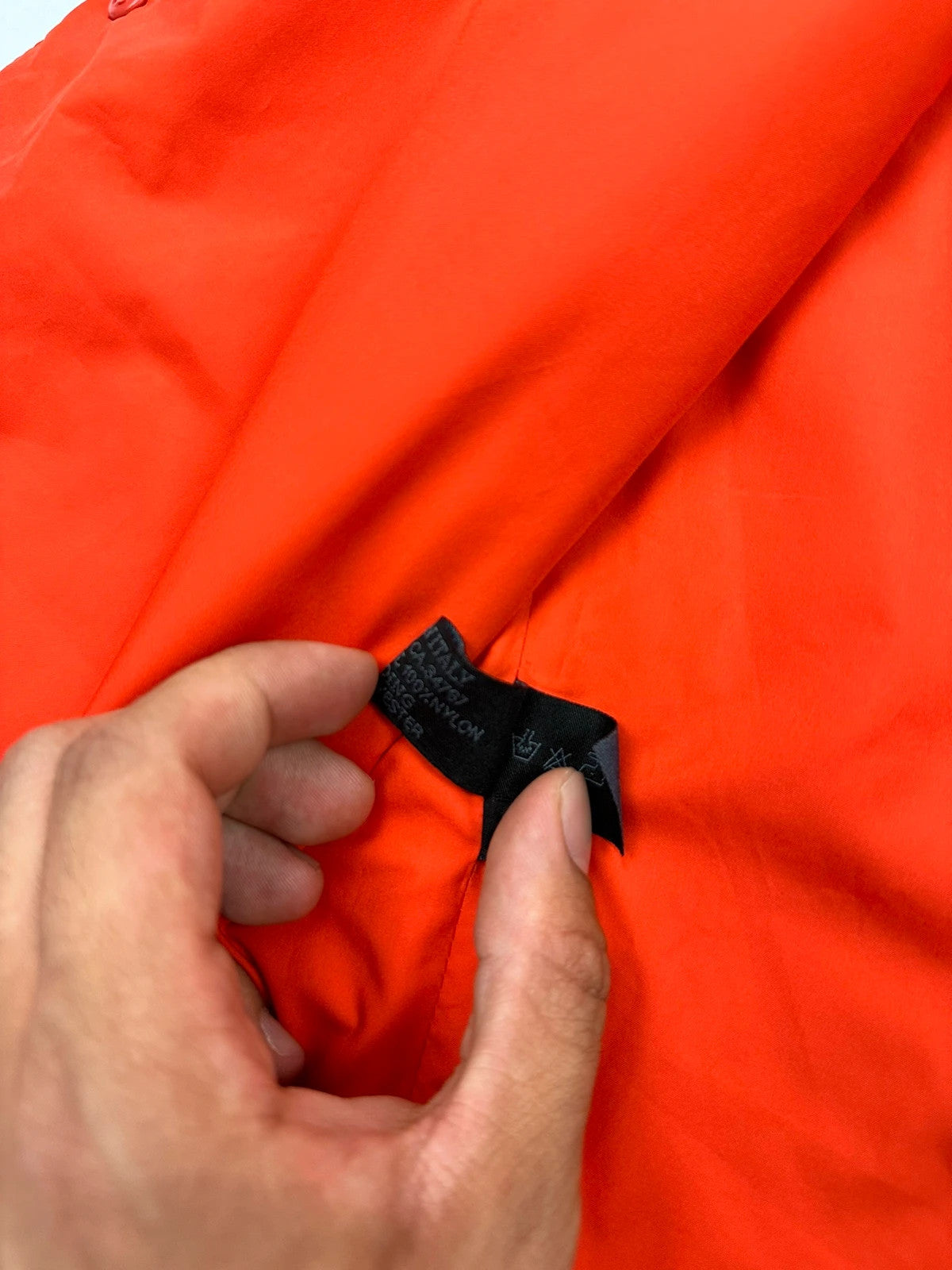 Prada orange nylon sleeveless vest jacket with logo detail from SS1999 collection.
