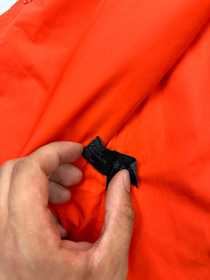 Prada orange nylon sleeveless vest jacket with logo detail from SS1999 collection.