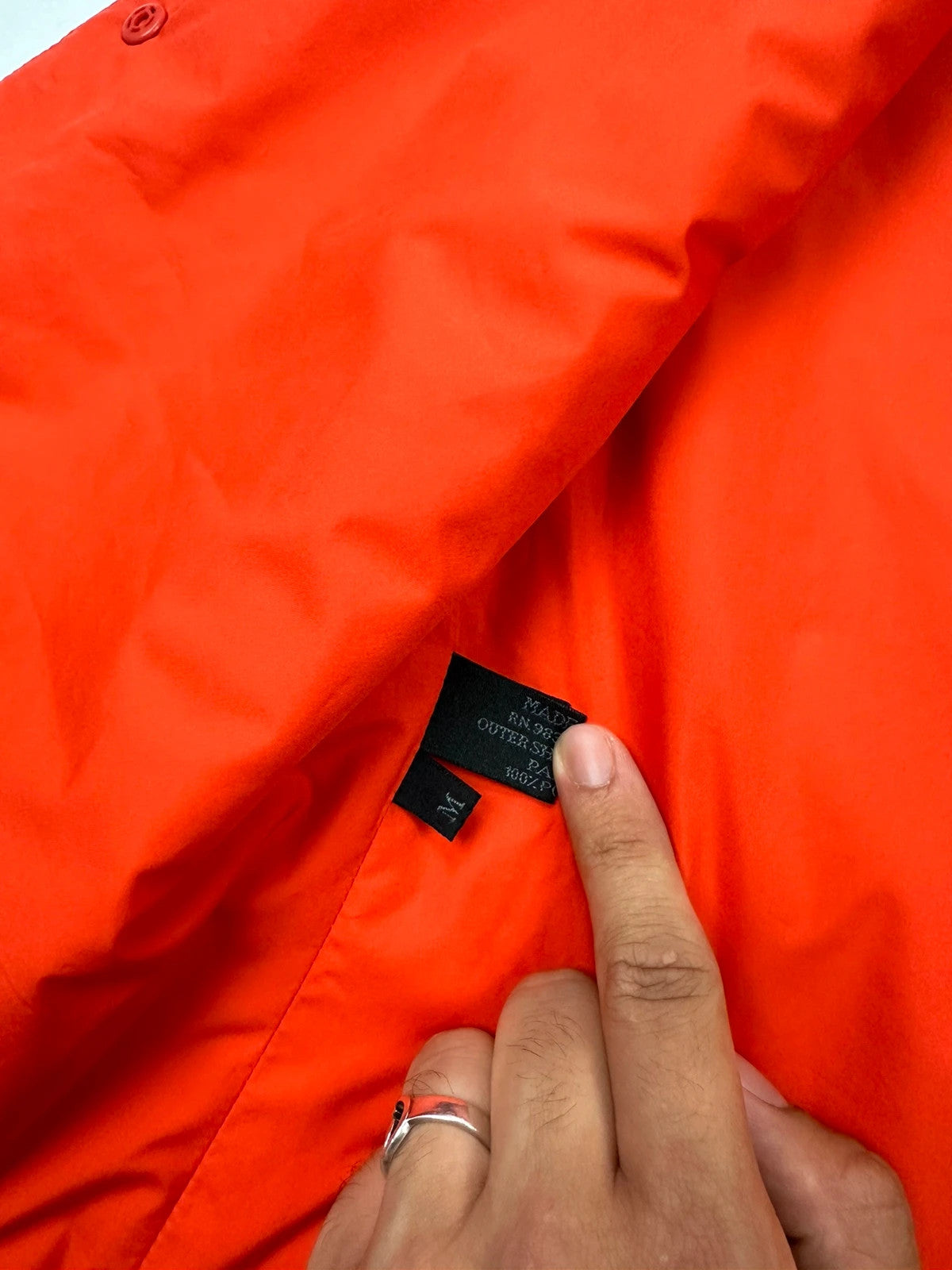 Prada orange nylon sleeveless vest jacket with logo detail from SS1999 collection.