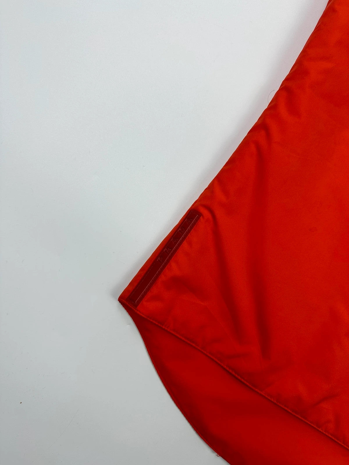 Prada orange nylon sleeveless vest jacket with logo detail from SS1999 collection.