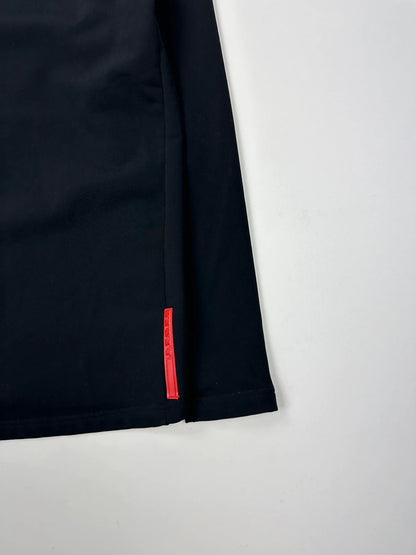 Prada black zip-up jacket featuring fleece material and iconic logo detail.