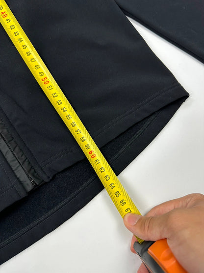 Prada black zip-up jacket featuring fleece material and iconic logo detail.