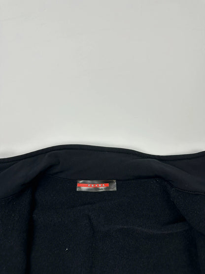 Prada black zip-up jacket featuring fleece material and iconic logo detail.
