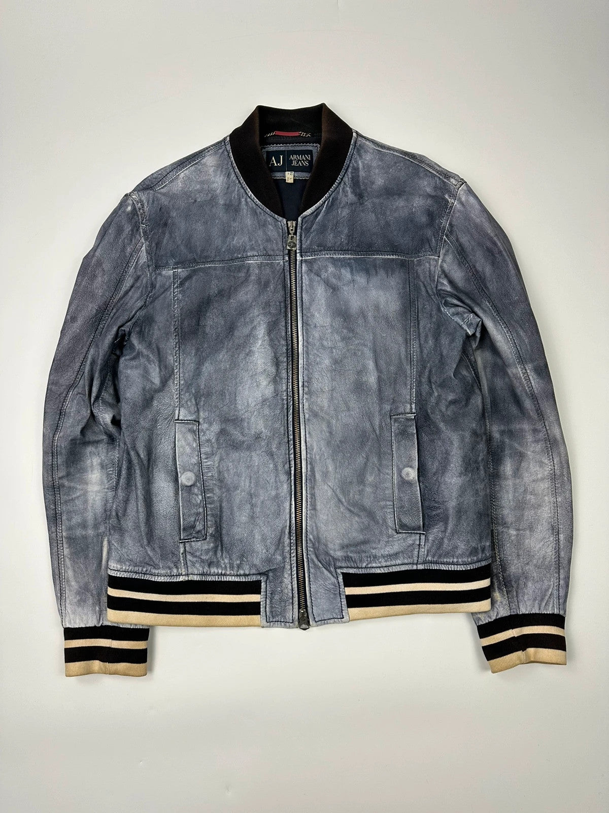 Armani blue and purple bomber jacket, eroded leather, vintage 2000s style.