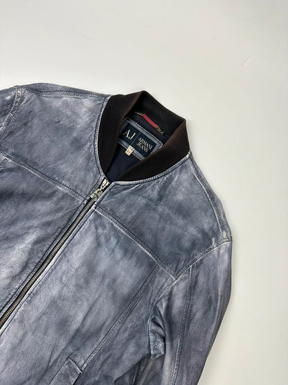 Armani blue and purple bomber jacket, eroded leather, vintage 2000s style.