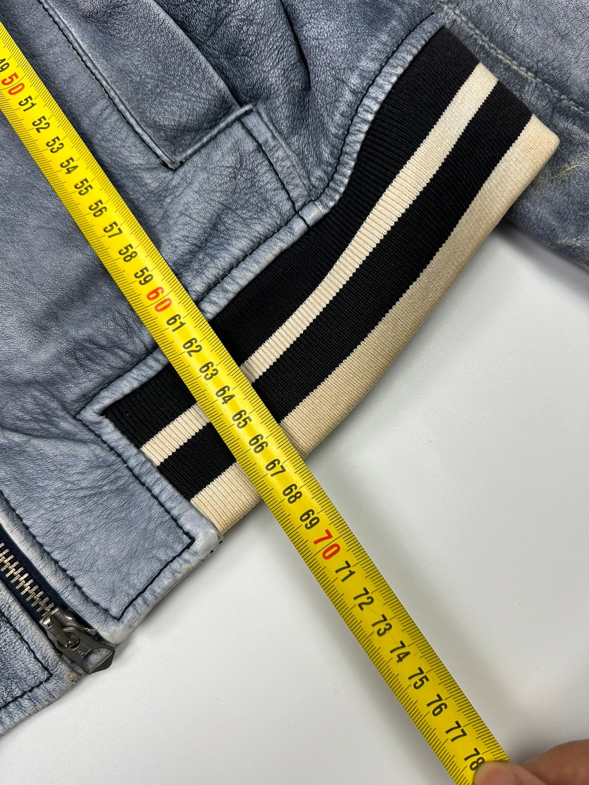 Armani blue and purple bomber jacket, eroded leather, vintage 2000s style.