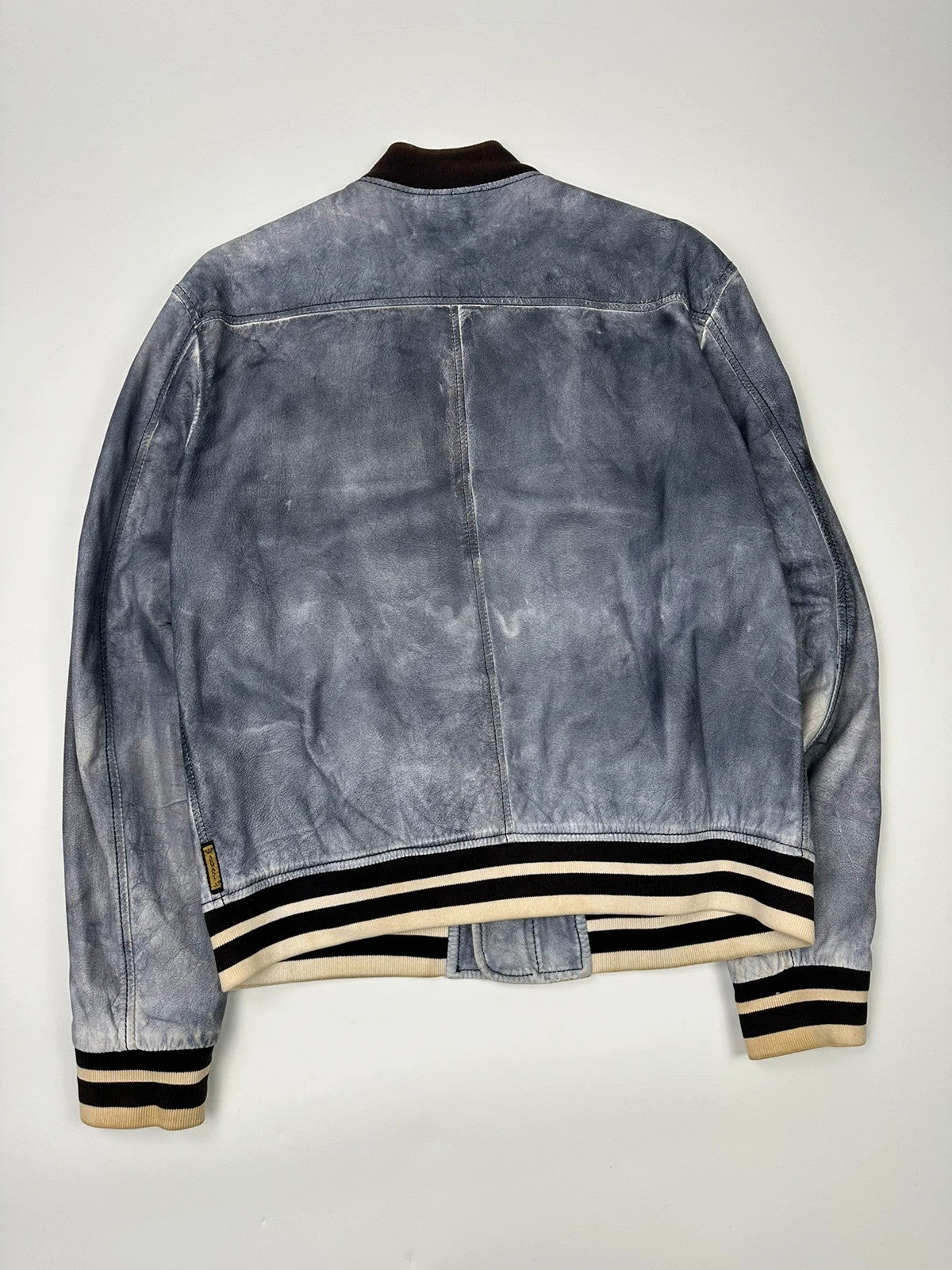 Armani blue and purple bomber jacket, eroded leather, vintage 2000s style.