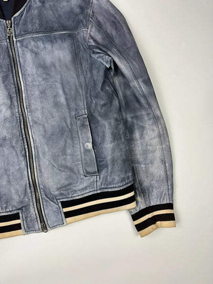 Armani blue and purple bomber jacket, eroded leather, vintage 2000s style.