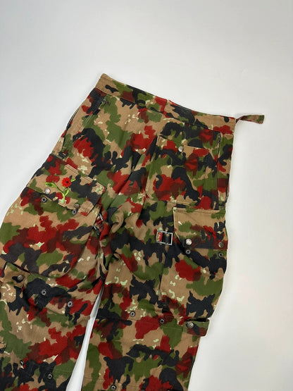 Dolce & Gabbana green camo wide-leg trousers with reworked straps and military pattern.