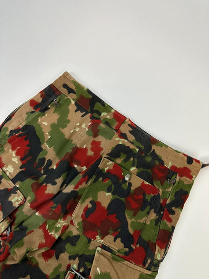 Dolce & Gabbana green camo wide-leg trousers with reworked straps and military pattern.