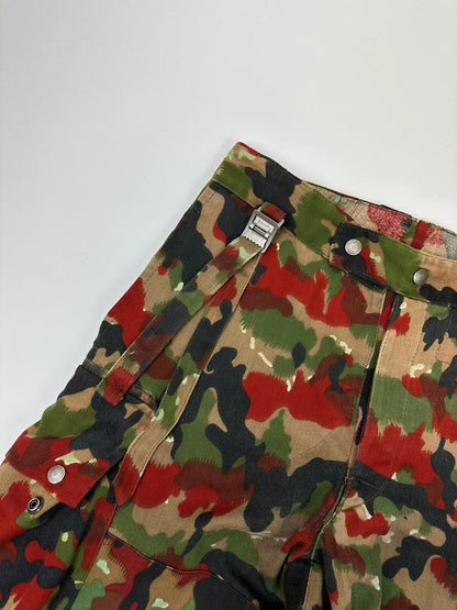 Dolce & Gabbana green camo wide-leg trousers with reworked straps and military pattern.