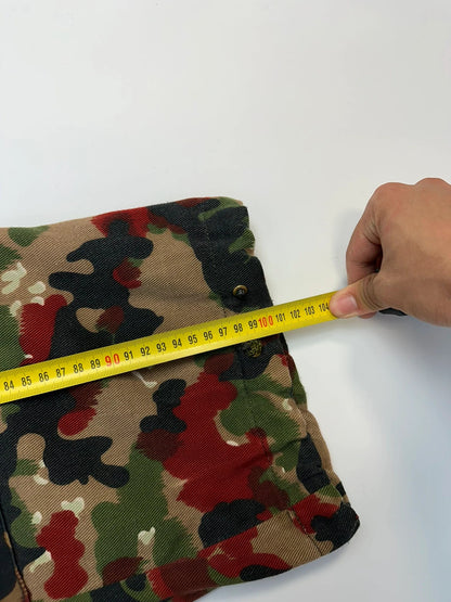 Dolce & Gabbana green camo wide-leg trousers with reworked straps and military pattern.