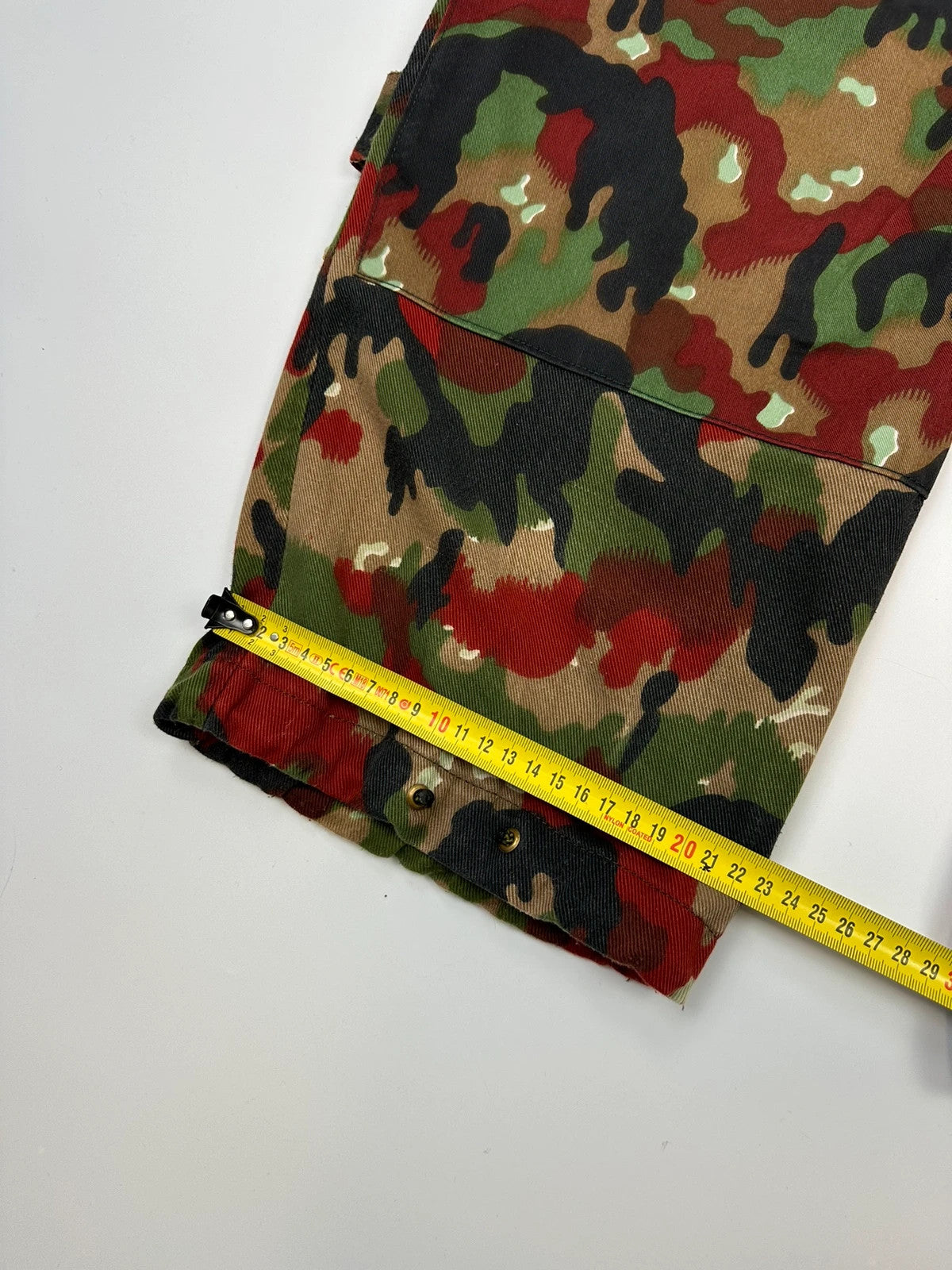 Dolce & Gabbana green camo wide-leg trousers with reworked straps and military pattern.