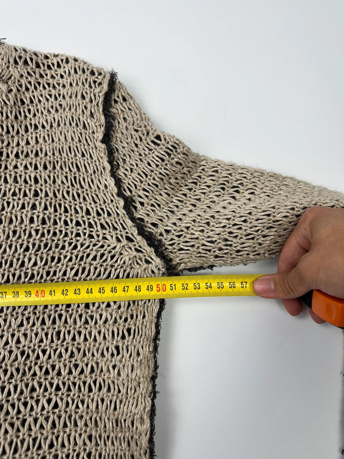 Dolce & Gabbana beige and brown knit sweater with visible stitching and fitted design.