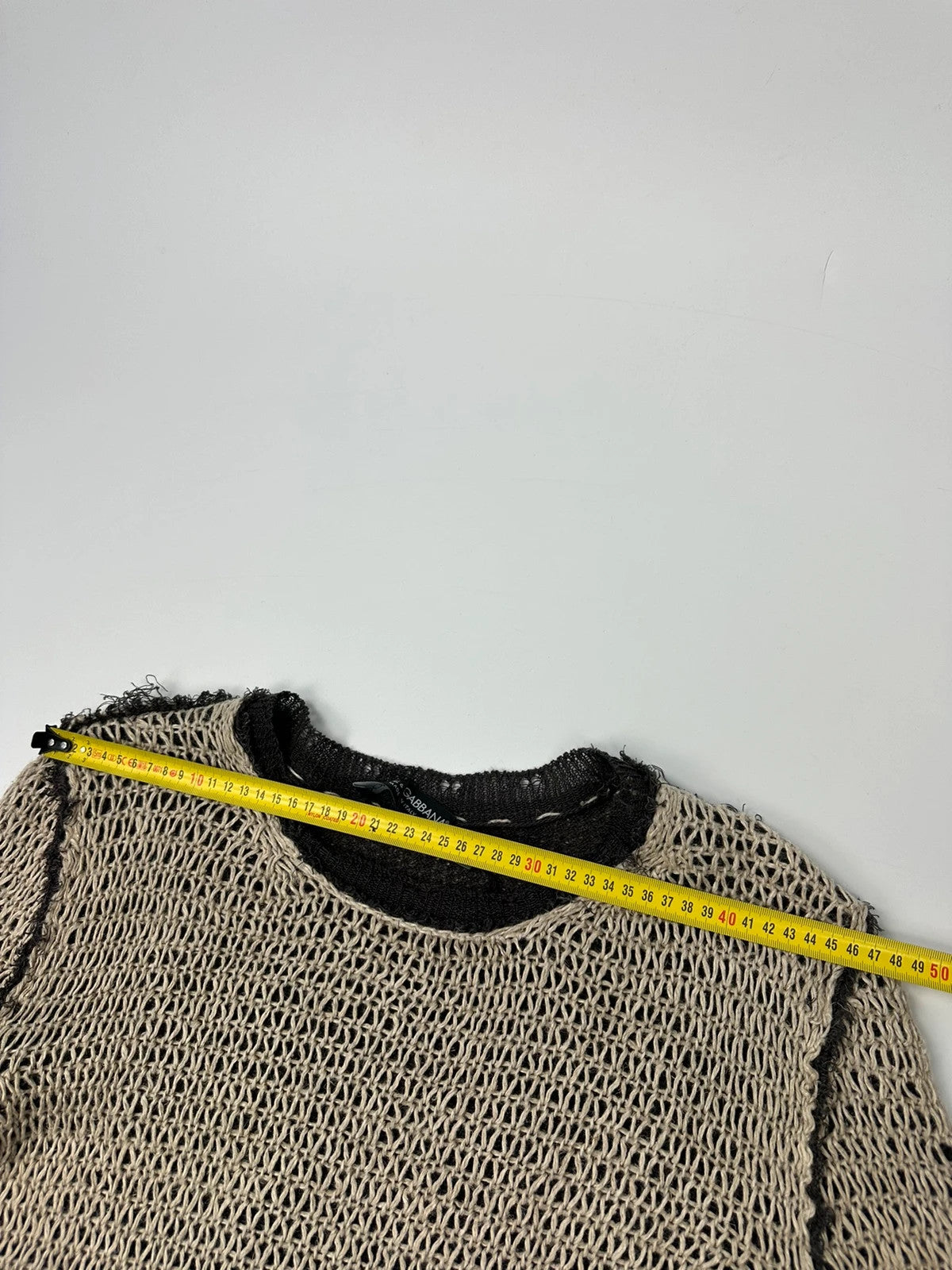 Dolce & Gabbana beige and brown knit sweater with visible stitching and fitted design.