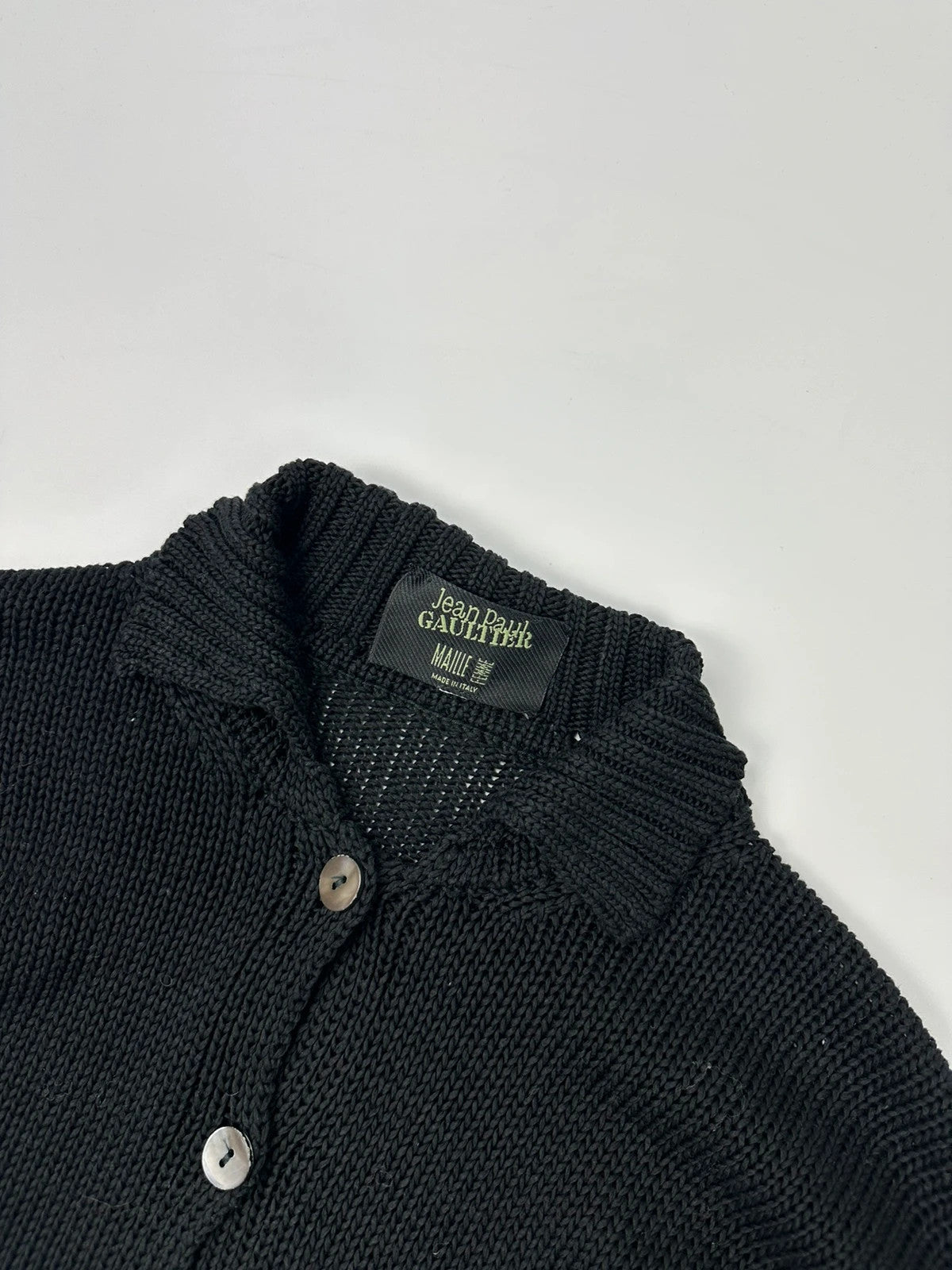 Jean-Paul Gaultier black knit cardigan with unique texture and minimalist design.