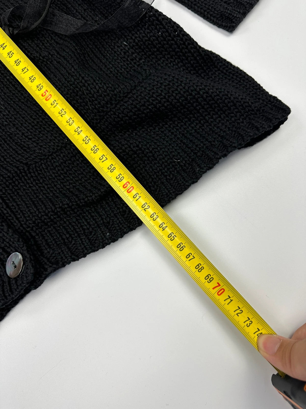 Jean-Paul Gaultier black knit cardigan with unique texture and minimalist design.