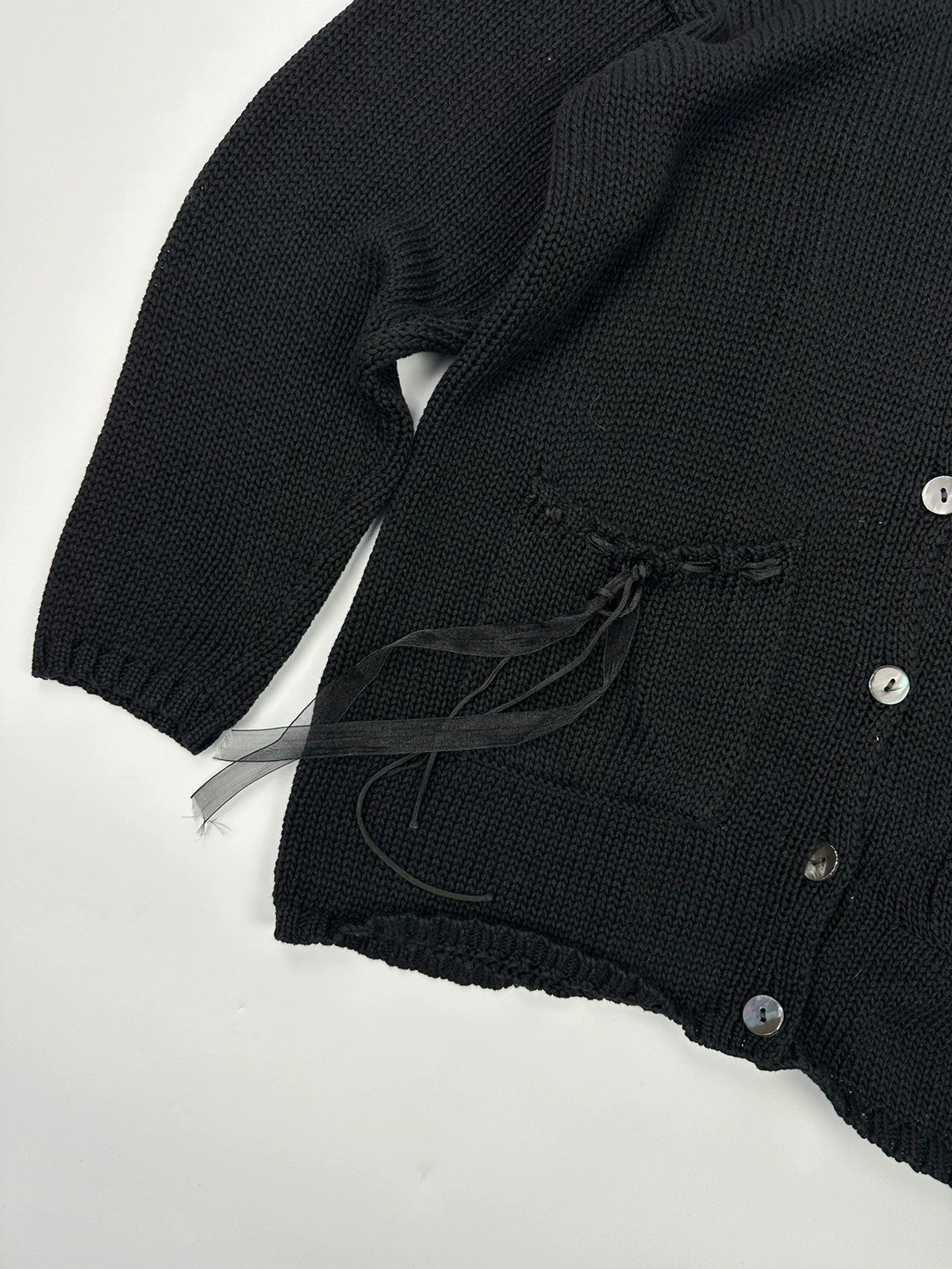 Jean-Paul Gaultier black knit cardigan with unique texture and minimalist design.