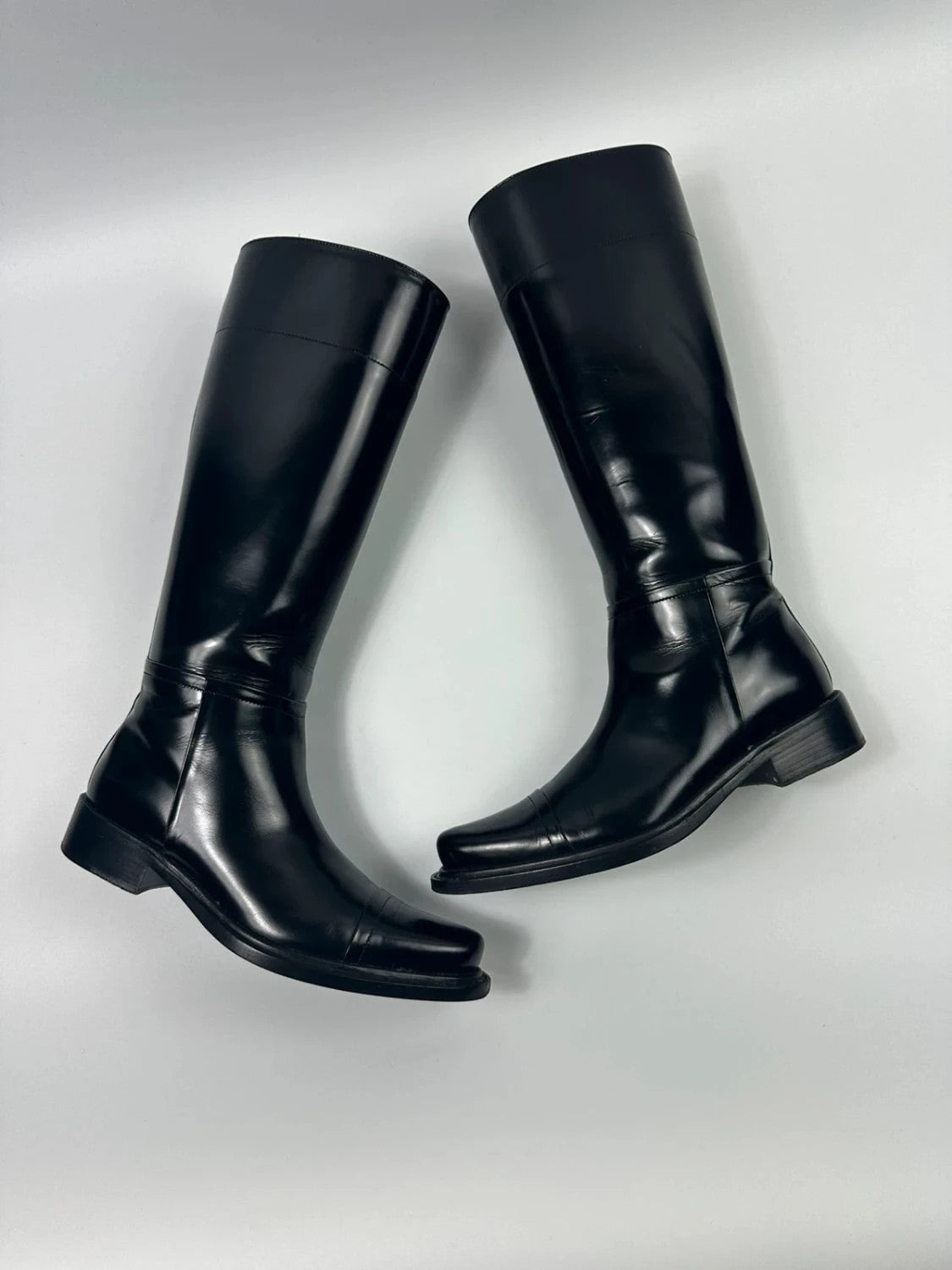 Prada black patent leather pointy toe boots with logo detail and original dustbag.