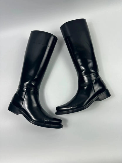 Prada black patent leather pointy toe boots with logo detail and original dustbag.