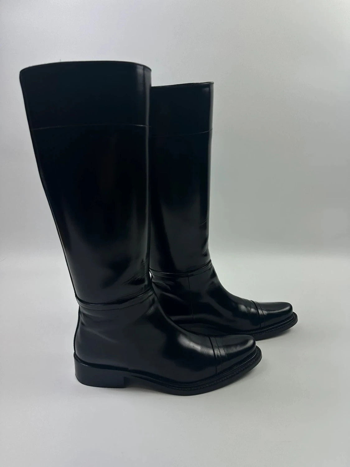 Prada black patent leather pointy toe boots with logo detail and original dustbag.