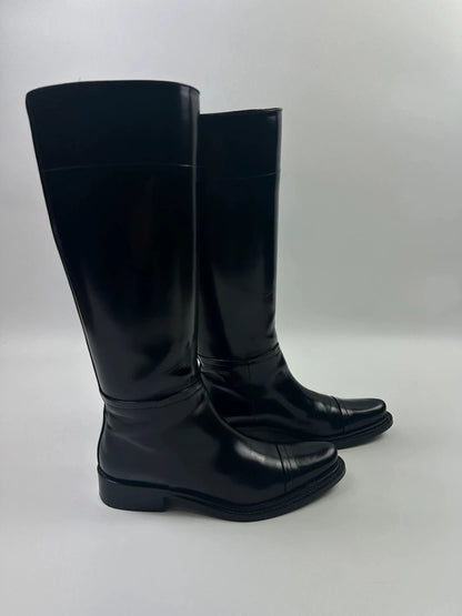 Prada black patent leather pointy toe boots with logo detail and original dustbag.