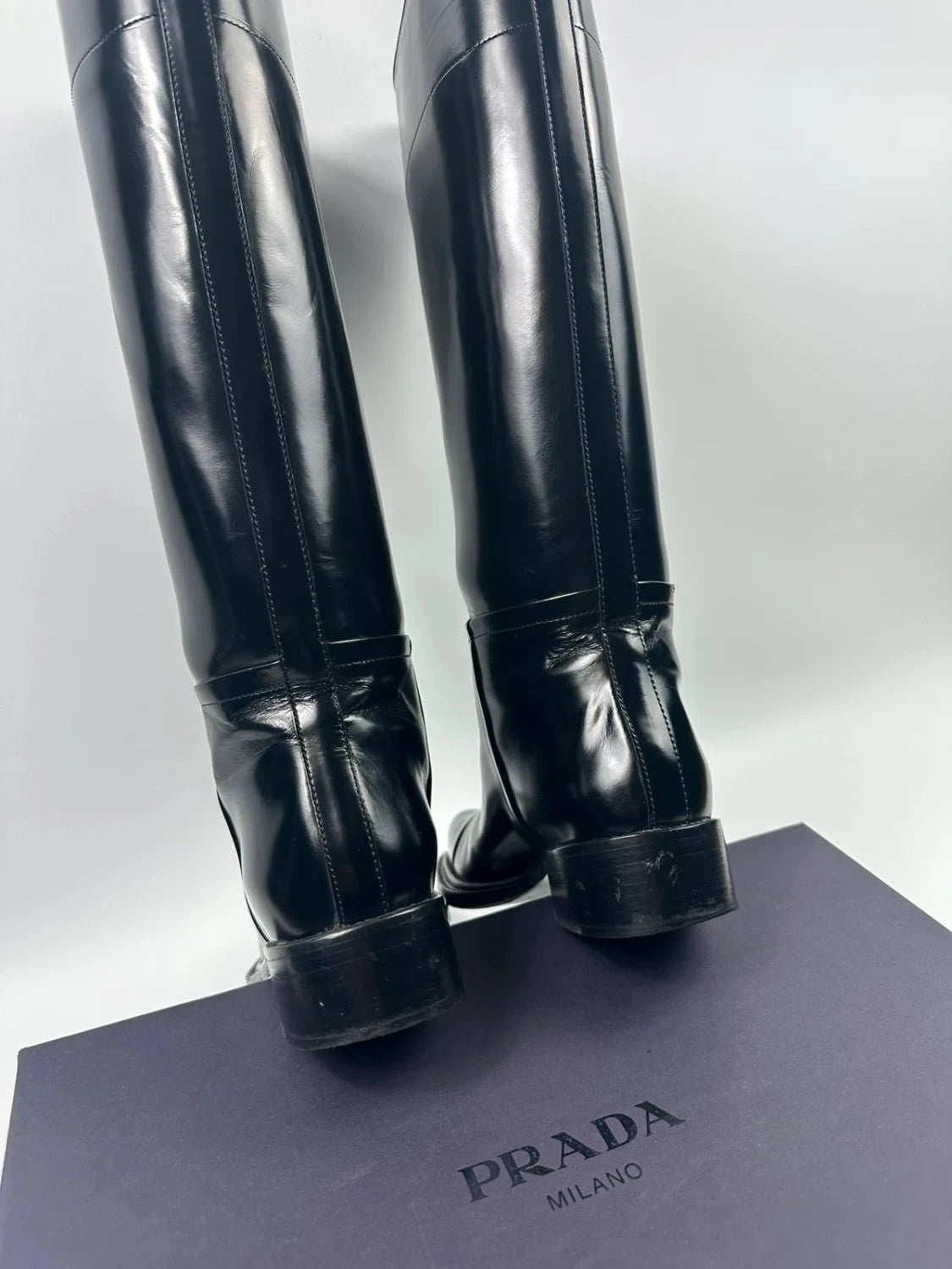 Prada black patent leather pointy toe boots with logo detail and original dustbag.